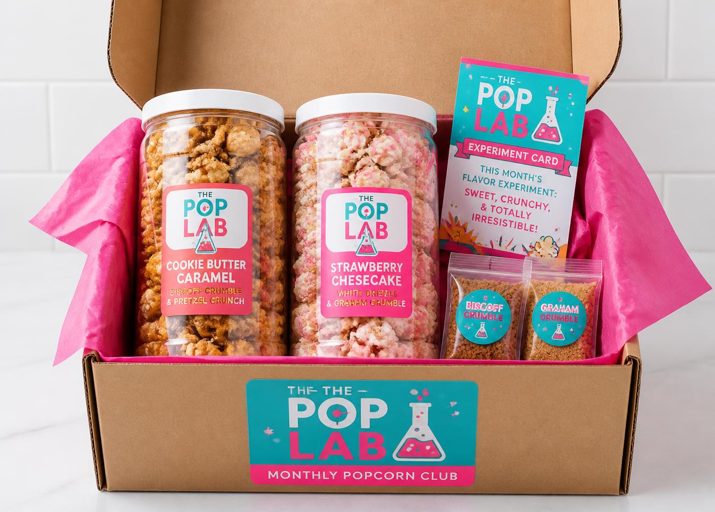 An open kraft Pop Lab Club box with two containers of loaded popcorn, topping packets and an Experiment Card